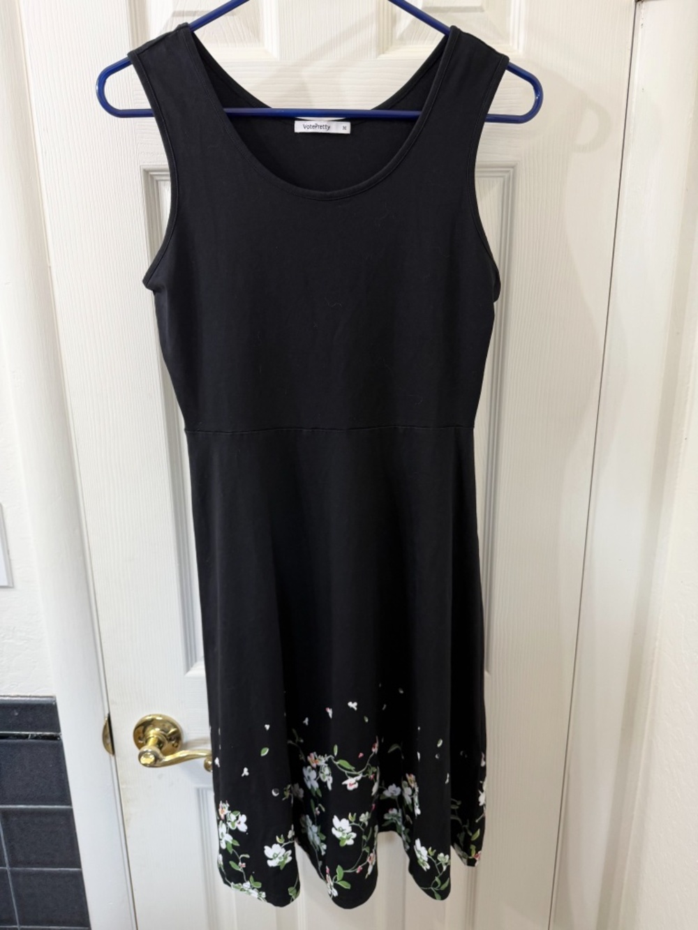 Black sleeveless with floral bottom design, casual, lightweight sundress. Size M